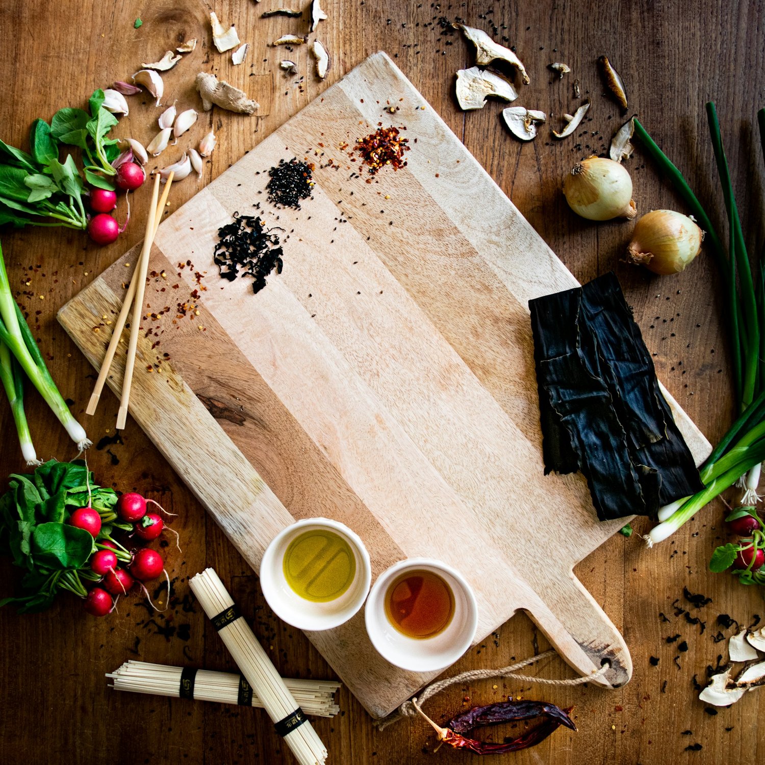 Japanese ingredients and utensils arranged on a wooden board